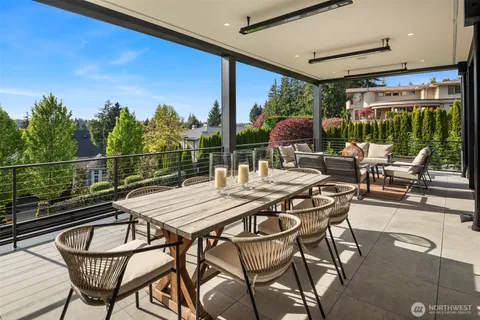 a view of a patio with a dining table and chairs