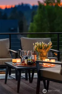 a view of a chairs and table in patio