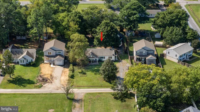 an aerial view of a house with outdoor space swimming pool and lake view