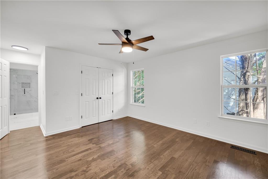 2941 Lake Hollow Road Gainesville, GA 30501 - Photo 24 of 53 a view of empty room with wooden floor and fan