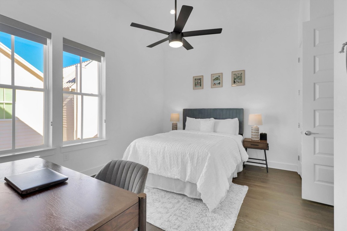 4806 Olive Sparrow Drive, Unit C Austin, TX 78723 - Photo 21 of 32 Bedroom with wood finished floors and a ceiling fan