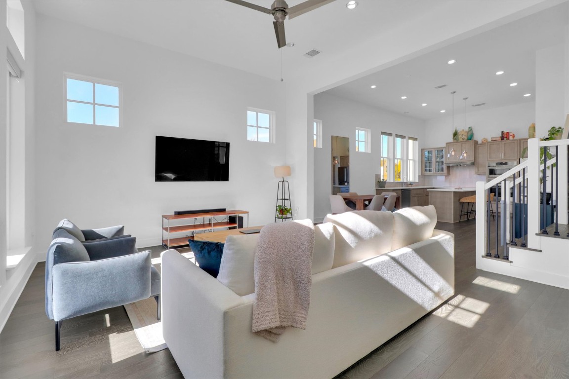 4806 Olive Sparrow Drive, Unit C Austin, TX 78723 - Photo 5 of 32 Living area featuring dark wood-style flooring, stairway, recessed lighting, and a ceiling fan