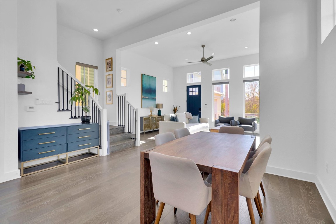 4806 Olive Sparrow Drive, Unit C Austin, TX 78723 - Photo 8 of 32 Dining area featuring recessed lighting, stairs, dark wood-style flooring, a ceiling fan, and a high ceiling