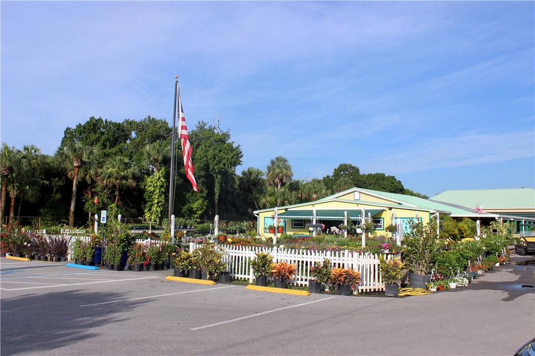 8050 Highway 1 Vero Beach, FL 32967 - Photo 13 of 16 a front view of a building with garden