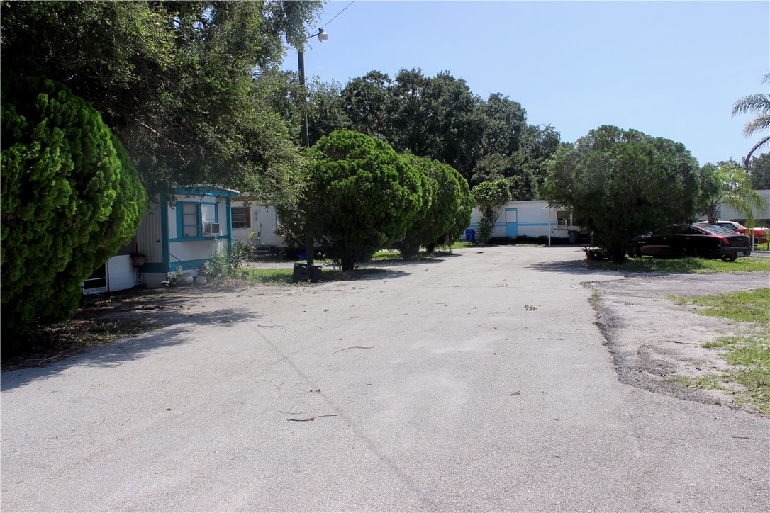 8050 Highway 1 Vero Beach, FL 32967 - Photo 4 of 16 a view of a house with a yard covered with snow in the background