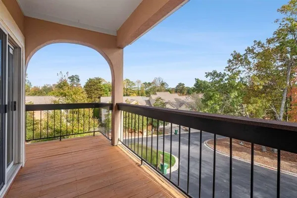 a view of a balcony with a table and chairs