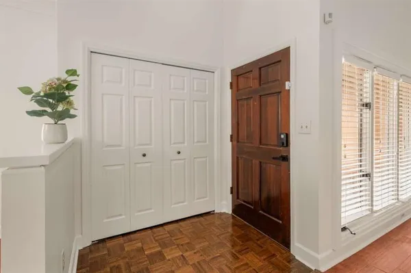 a view of an entryway with wooden floor