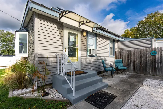 a view of backyard with sitting area