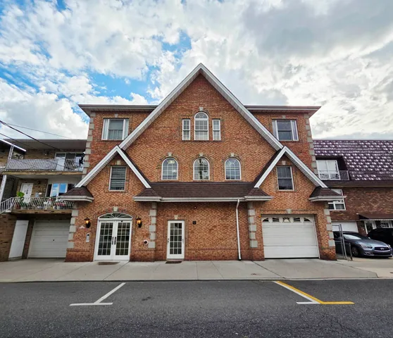a front view of a house with a garage