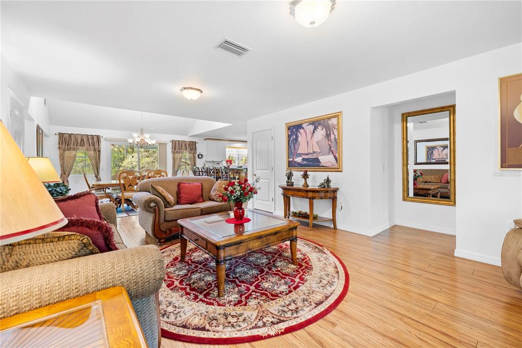 7347 Packingham Drive Webster, FL 33597 - Photo 11 of 75 a living room with furniture and a dining table