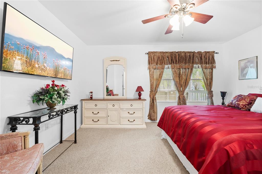 7347 Packingham Drive Webster, FL 33597 - Photo 35 of 75 a bedroom with a bed and a large window
