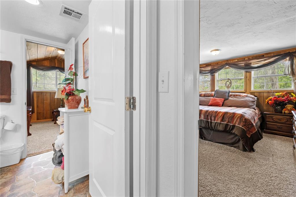 7347 Packingham Drive Webster, FL 33597 - Photo 52 of 75 a bedroom with bed and a window