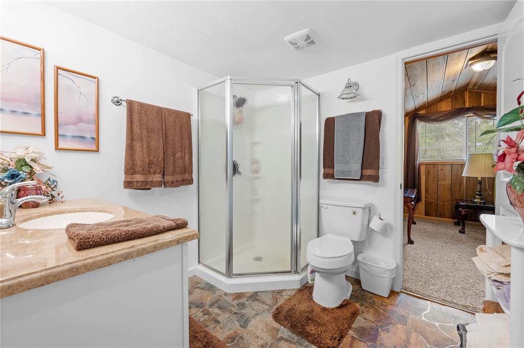 7347 Packingham Drive Webster, FL 33597 - Photo 57 of 75 a bathroom with a sink toilet and shower