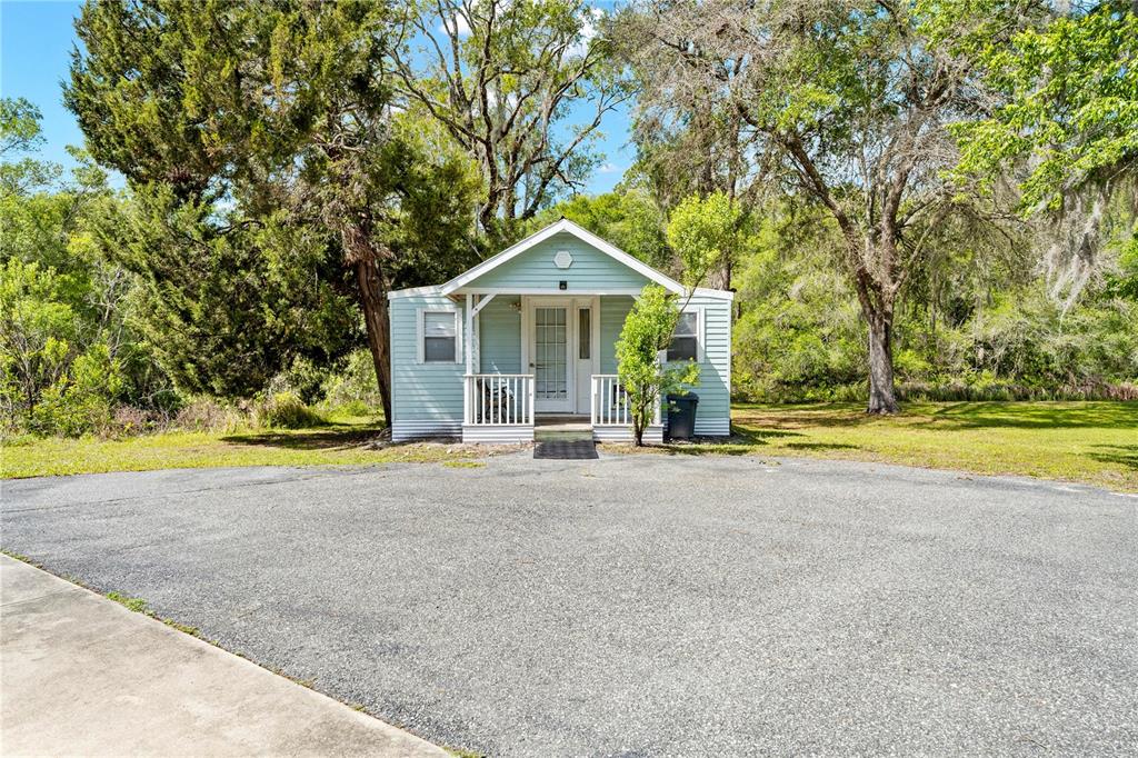 7347 Packingham Drive Webster, FL 33597 - Photo 65 of 75 a view of a house with a big yard and large trees
