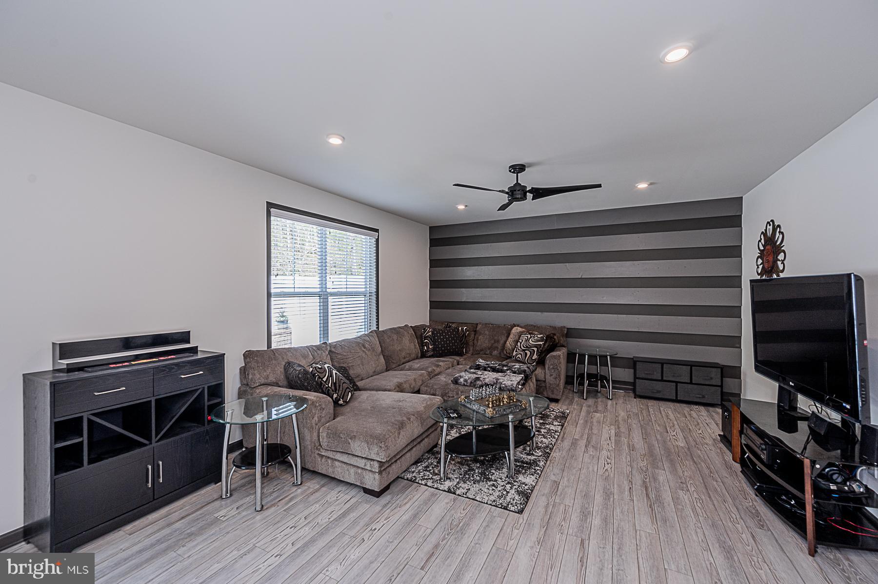 7250 Wright Road Hanover, MD 21076 - Photo 6 of 48 Family room with custom accent wall