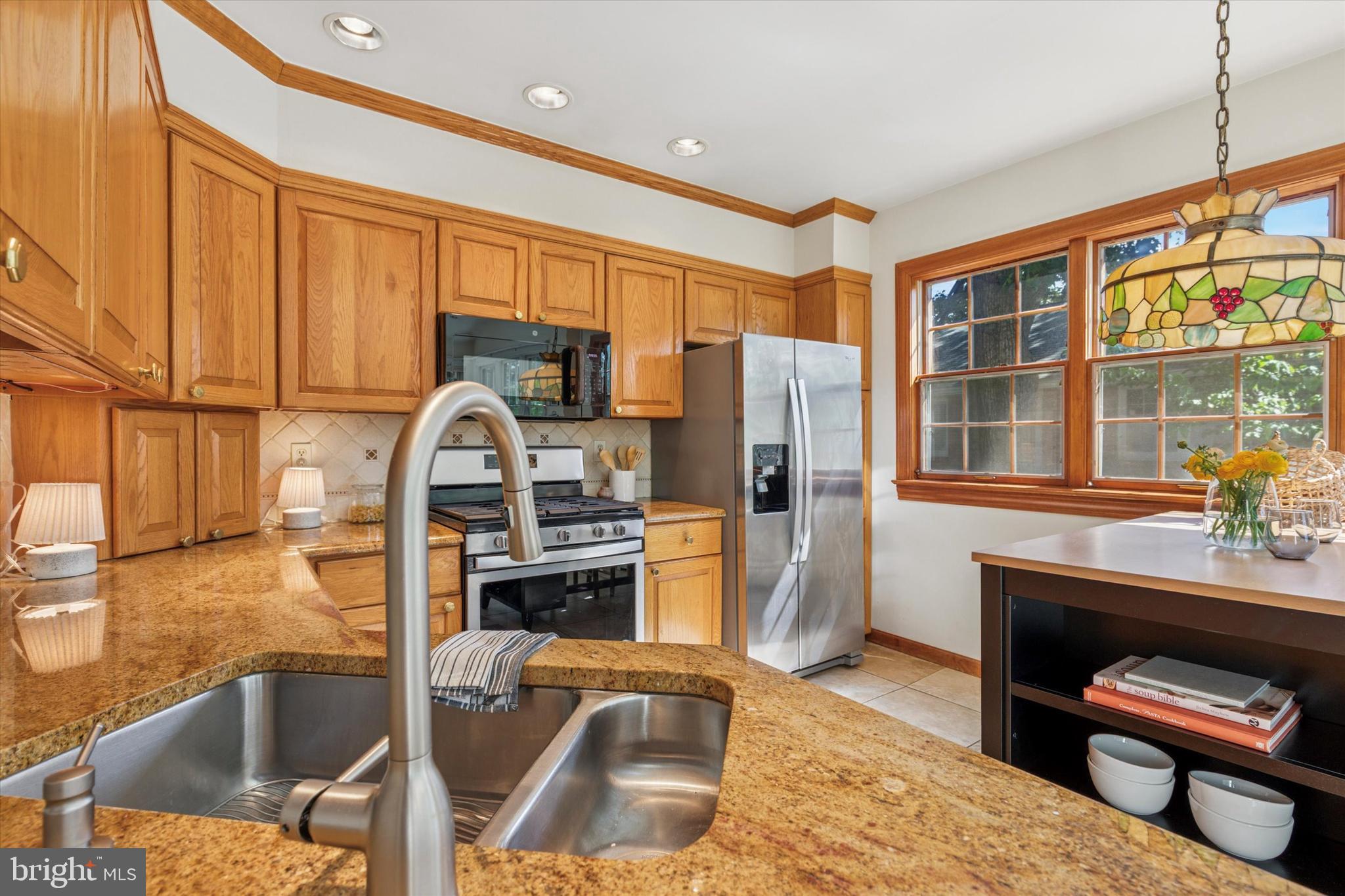 508 Baird Road Merion Station, PA 19066 - Photo 12 of 52 a kitchen with stainless steel appliances granite countertop a refrigerator and a stove top oven