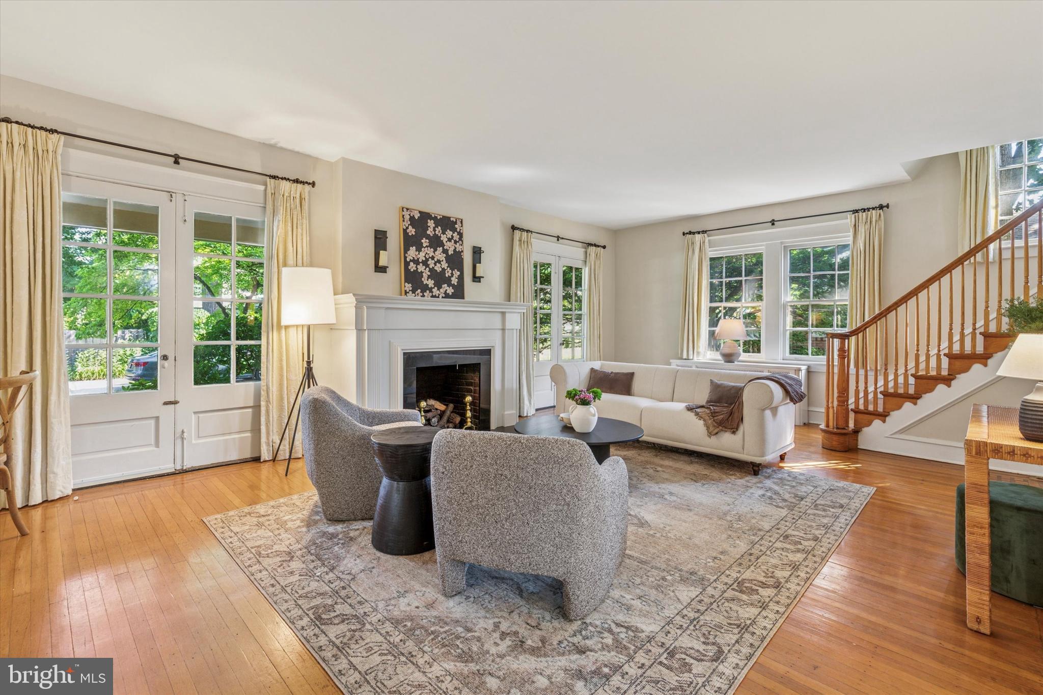 508 Baird Road Merion Station, PA 19066 - Photo 20 of 52 a living room with furniture large window and a fireplace