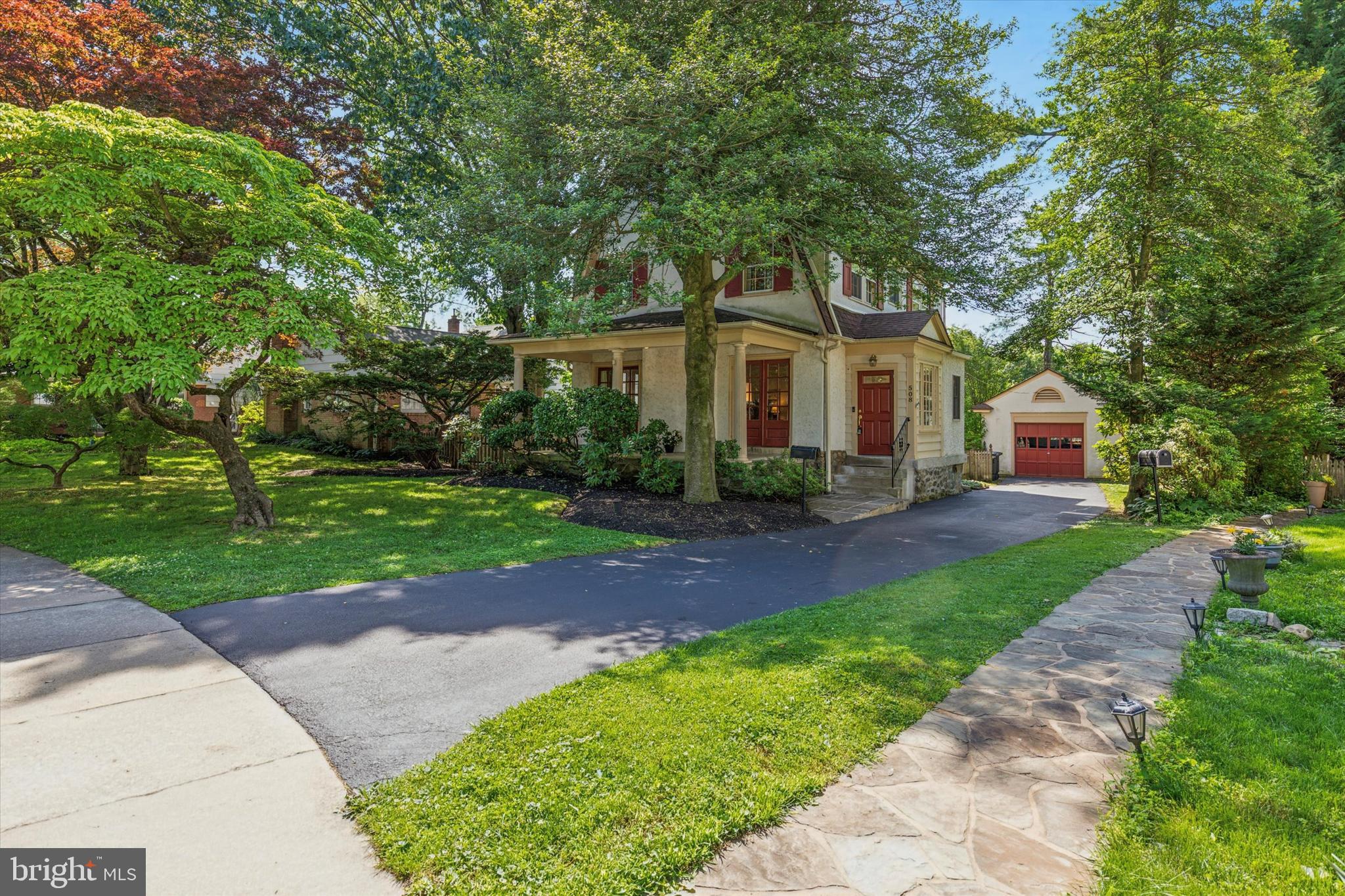 508 Baird Road Merion Station, PA 19066 - Photo 3 of 52 a front view of a house with garden