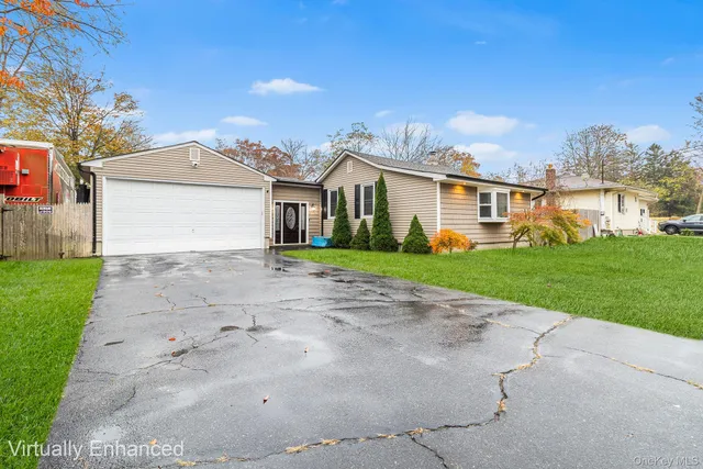 a front view of house with yard and green space
