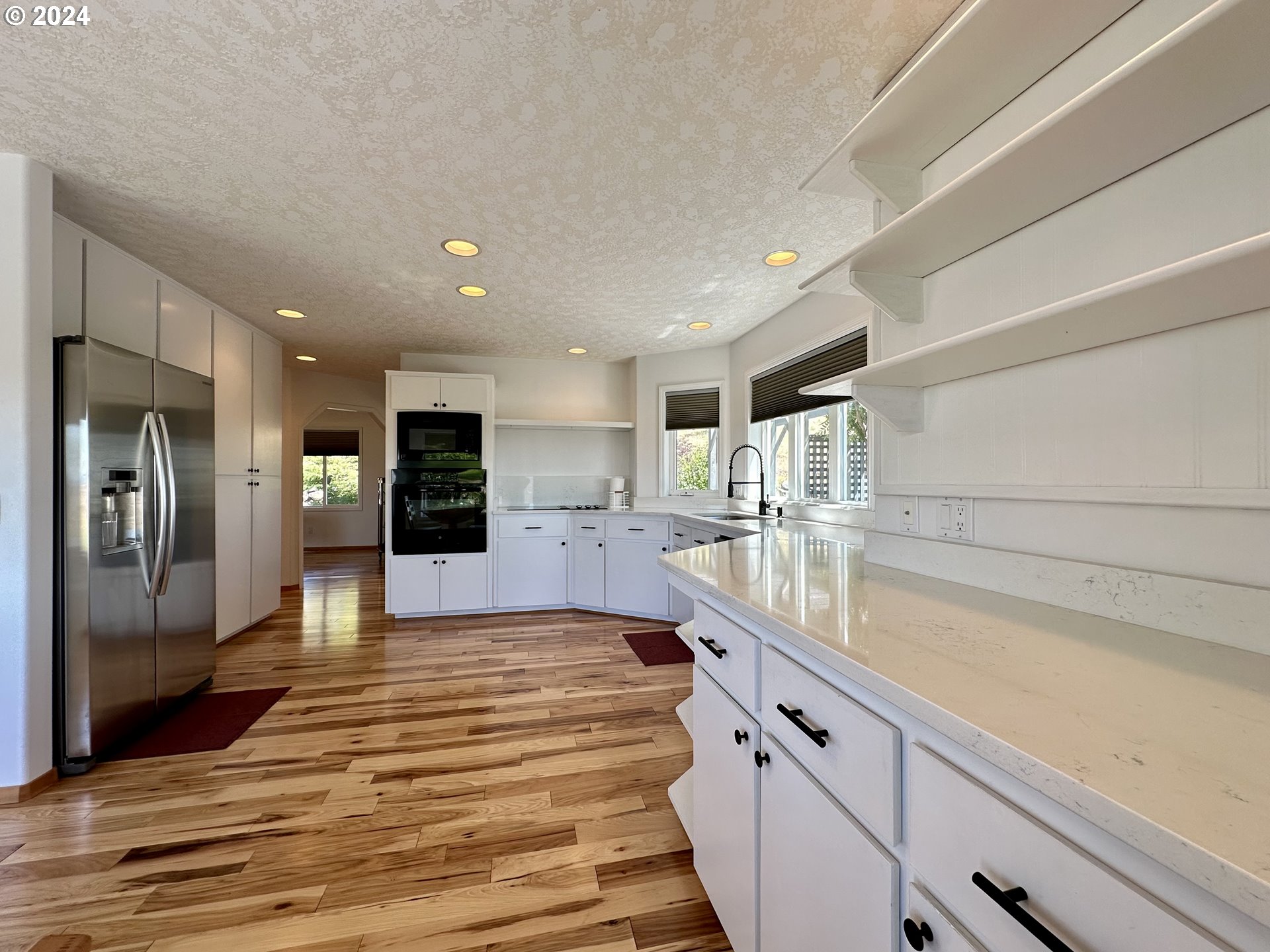110 Eagle Drive Goldendale, WA 98620 - Photo 22 of 48 a large kitchen with kitchen island a sink stainless steel appliances and cabinets