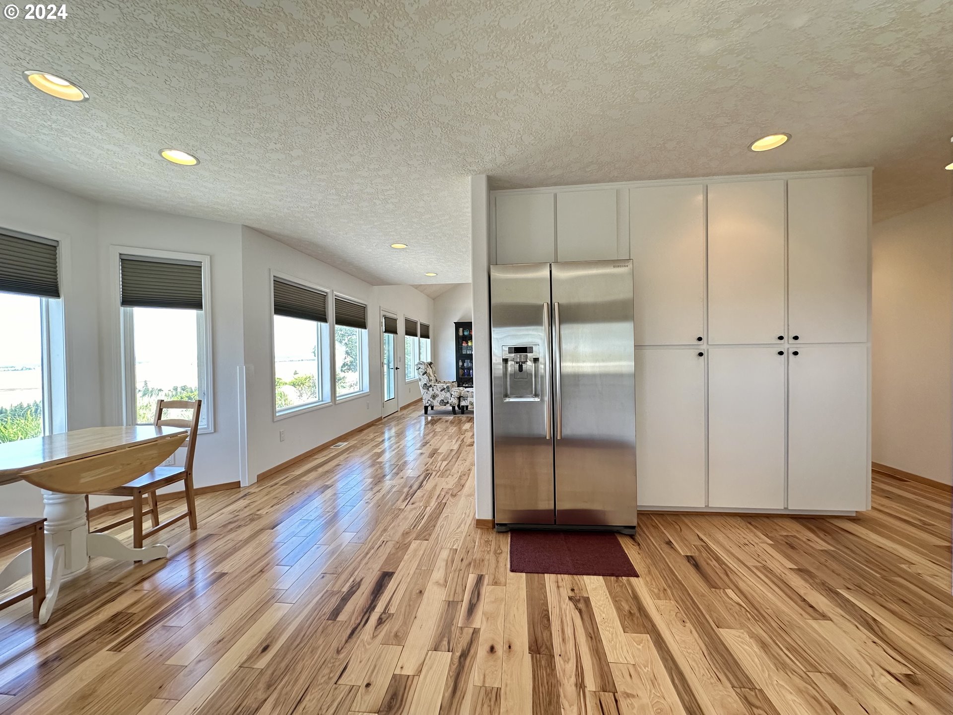 110 Eagle Drive Goldendale, WA 98620 - Photo 23 of 48 a view of a room with wooden floor lounge chair and windows