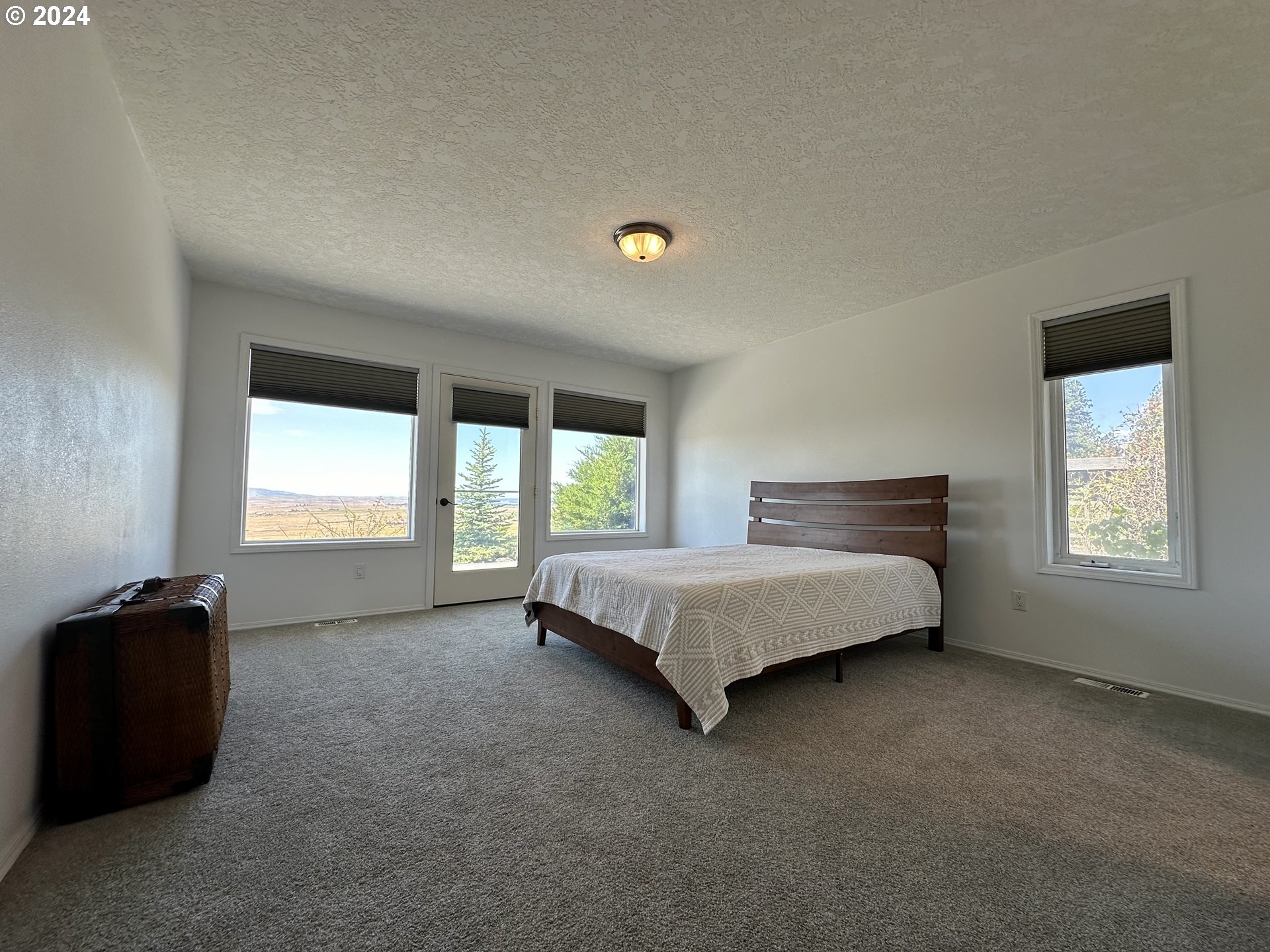 110 Eagle Drive Goldendale, WA 98620 - Photo 29 of 48 a spacious bedroom with a bed and window