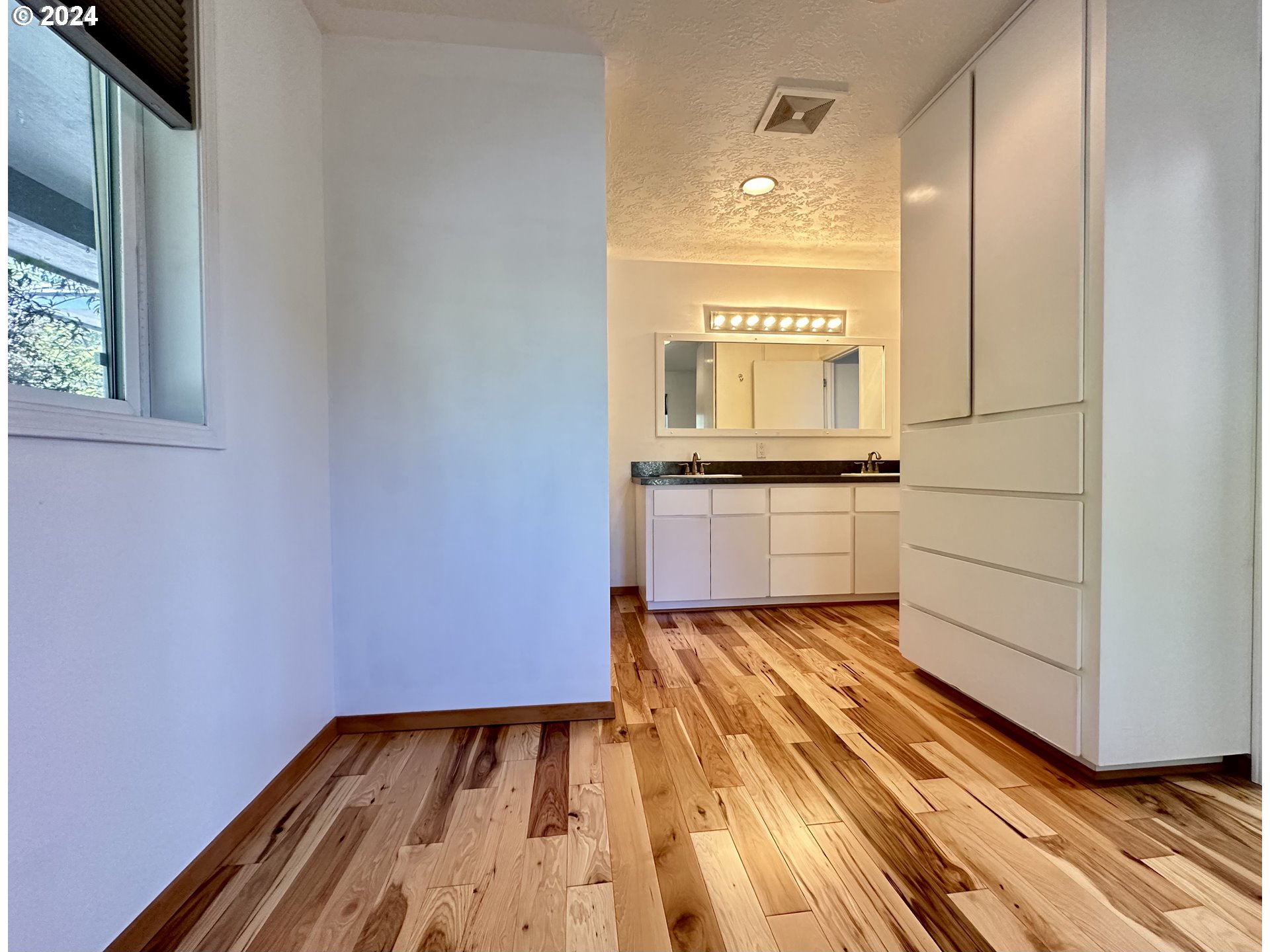 110 Eagle Drive Goldendale, WA 98620 - Photo 31 of 48 a view of a hallway with wooden floor and a fireplace