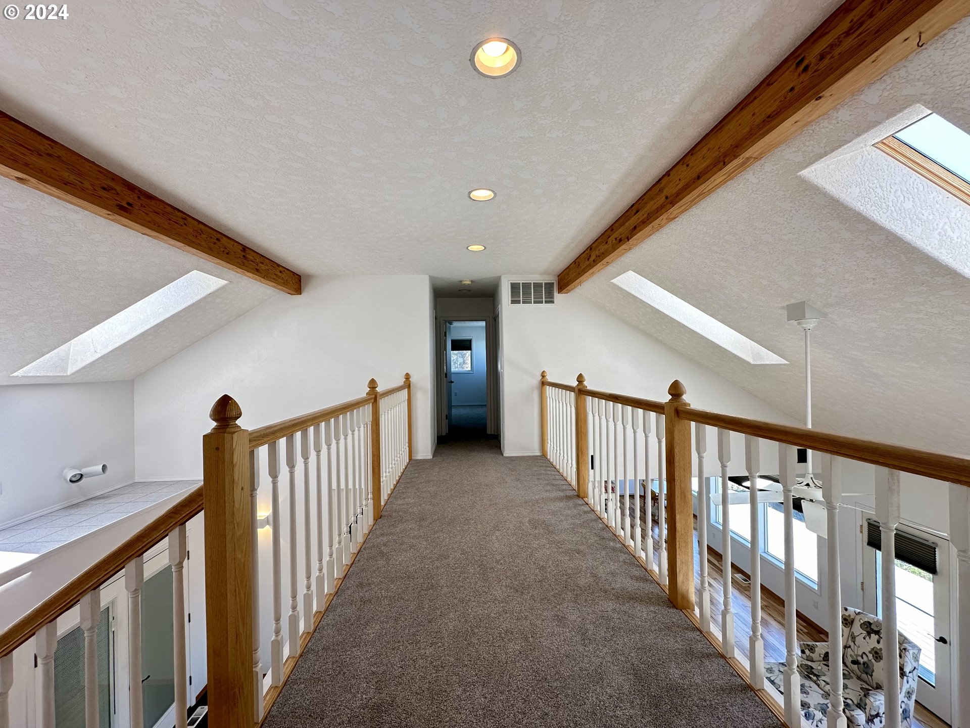 110 Eagle Drive Goldendale, WA 98620 - Photo 33 of 48 a view of staircase with lots of frames on wall and windows