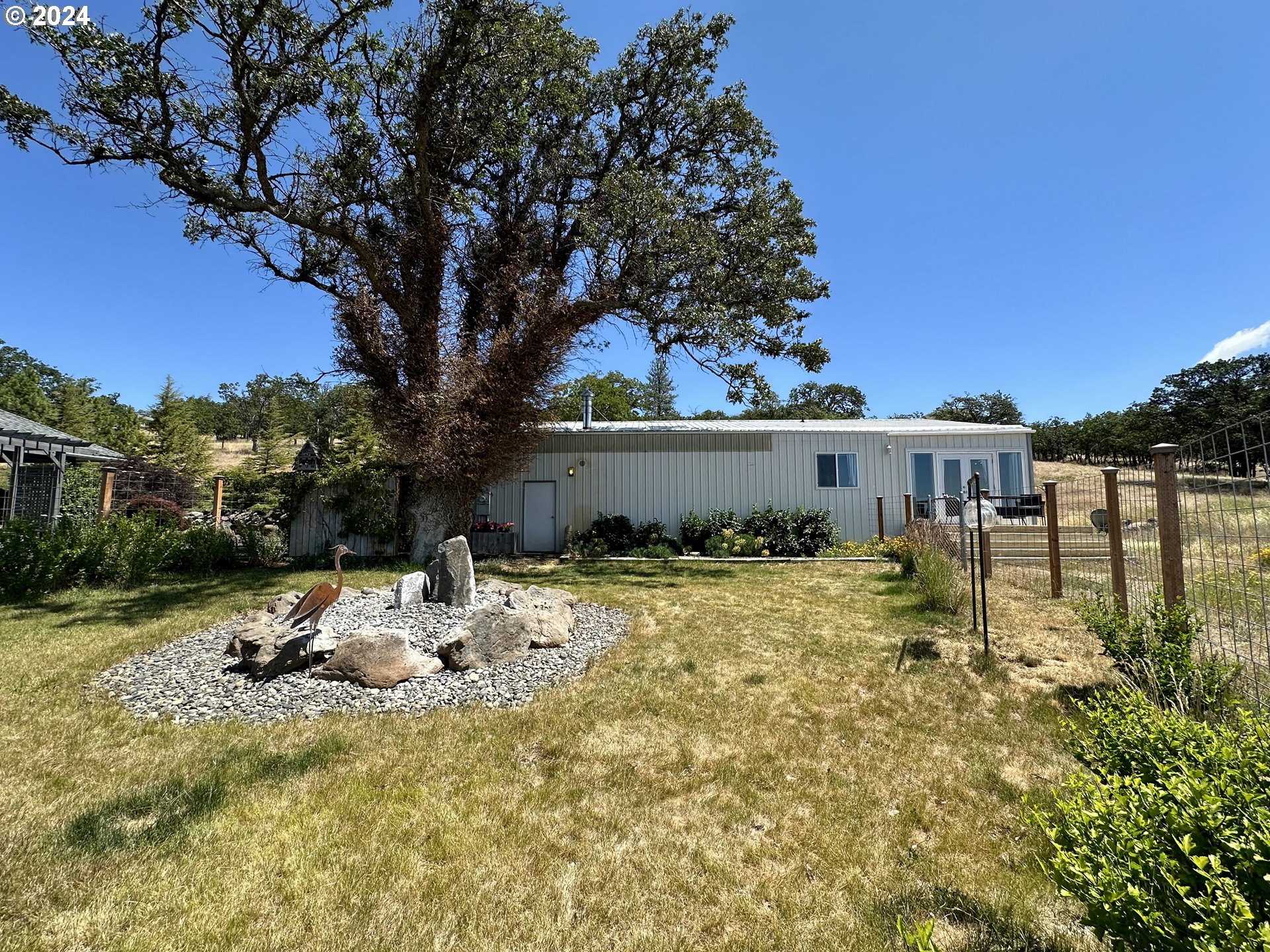 110 Eagle Drive Goldendale, WA 98620 - Photo 39 of 48 a backyard of a house with table and chairs