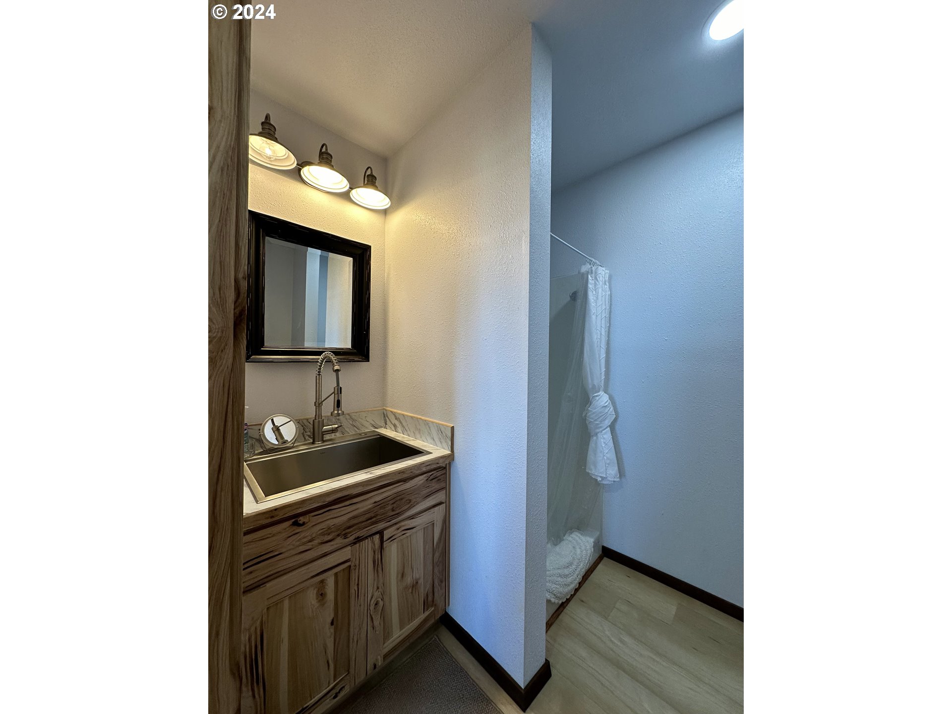 110 Eagle Drive Goldendale, WA 98620 - Photo 47 of 48 a bathroom with a sink and a mirror
