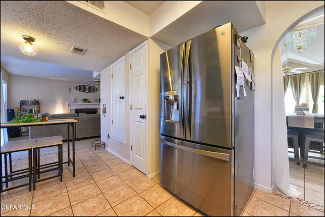 a kitchen with stainless steel appliances a refrigerator and a stove