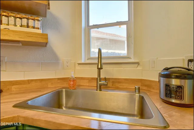 a kitchen with a sink and a window