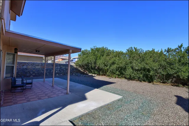 a view of a backyard of a house