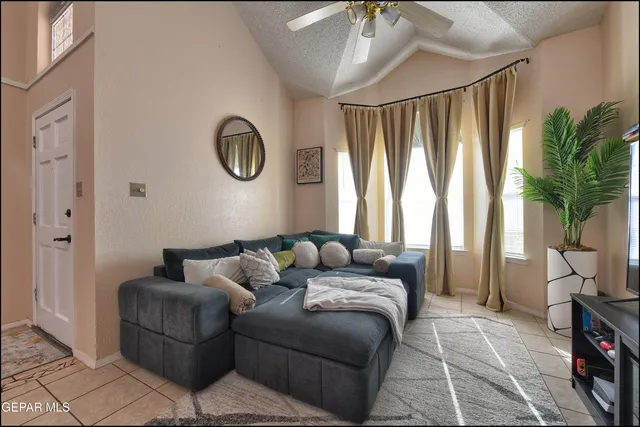 a living room with furniture and a large window