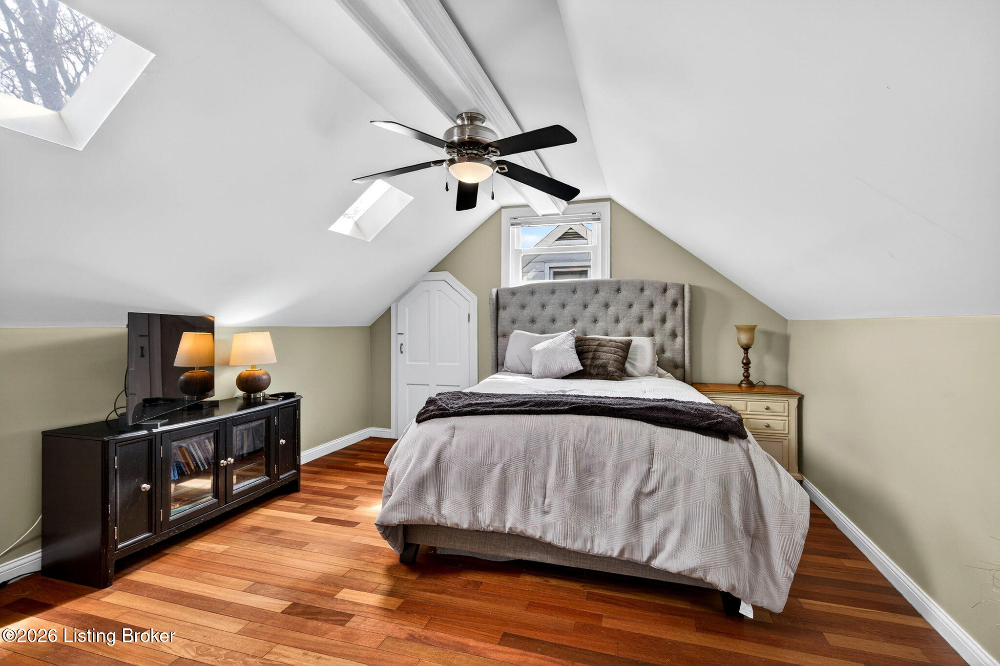 3101 Bobolink Road Louisville, KY 40213 - Photo 29 of 57 A vaulted ceiling with exposed beams and dual skylights creates a dramatic and light-filled retreat