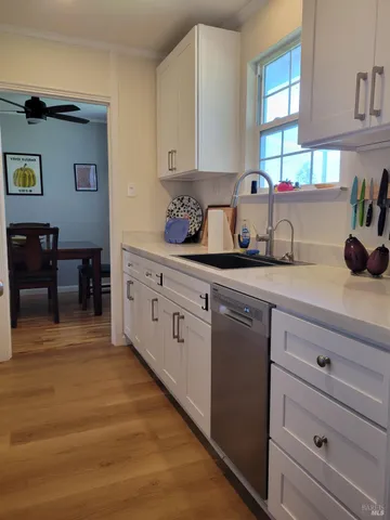 a kitchen with sink and cabinets