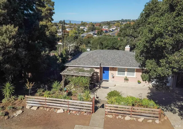 aerial view of a house with a yard