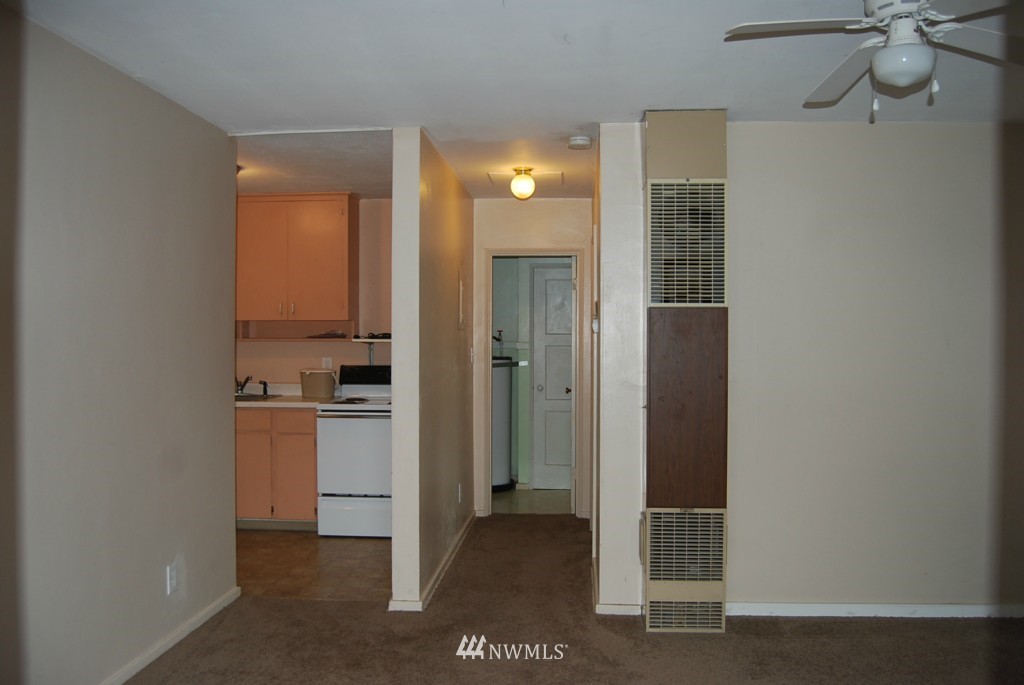 859 Edmonds Avenue Northeast Renton, WA 98056 - Photo 11 of 22 a view of a kitchen with a refrigerator and a stove top oven