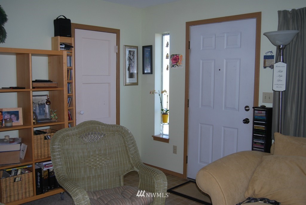 859 Edmonds Avenue Northeast Renton, WA 98056 - Photo 16 of 22 a living room with furniture and a flat screen tv