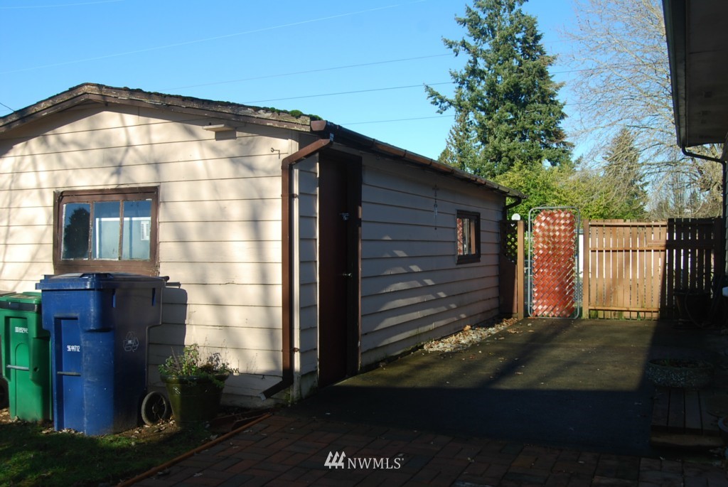 859 Edmonds Avenue Northeast Renton, WA 98056 - Photo 19 of 22 a view of a house with a yard
