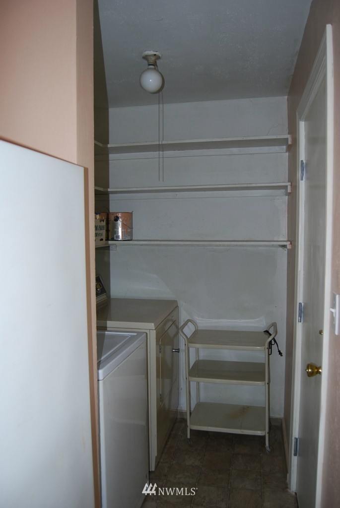 859 Edmonds Avenue Northeast Renton, WA 98056 - Photo 7 of 22 a view of storage and utility room with racks on the wall