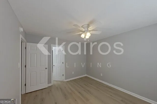 an empty room with wooden floor