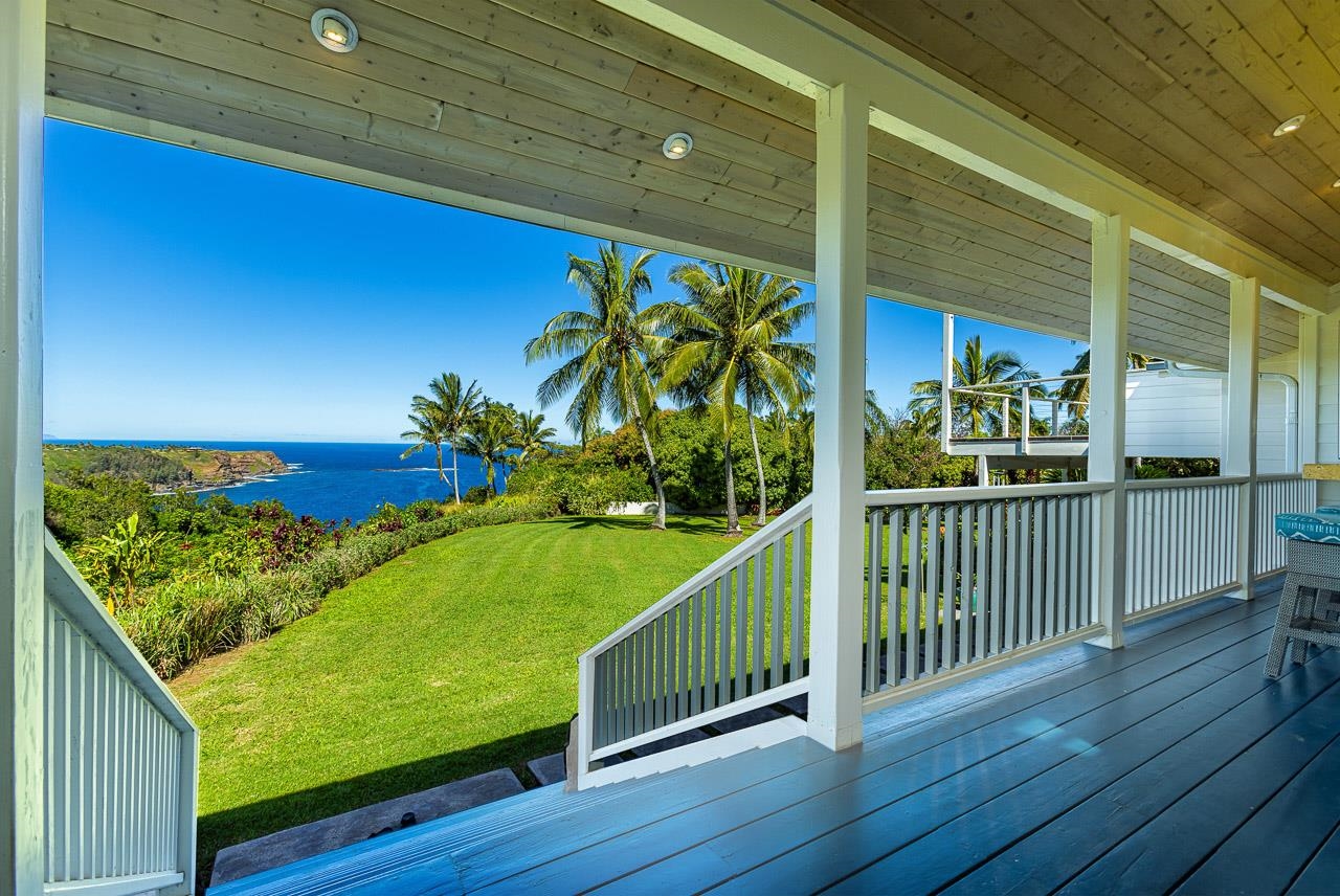 555 North Holokai Road Haiku, HI 96708 - Photo 19 of 50 The ocean-side lanai leads down to a verdant lawn