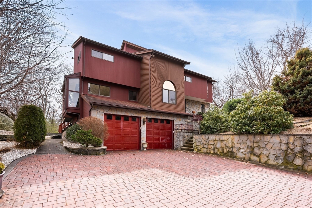 4 Rockland Terrace Saugus, MA 01906 - Photo 1 of 42 a front view of a house with a yard and garage