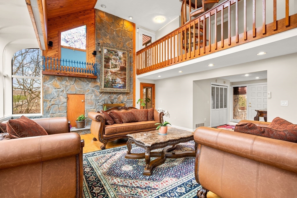 4 Rockland Terrace Saugus, MA 01906 - Photo 12 of 42 a living room with furniture a rug and a fireplace