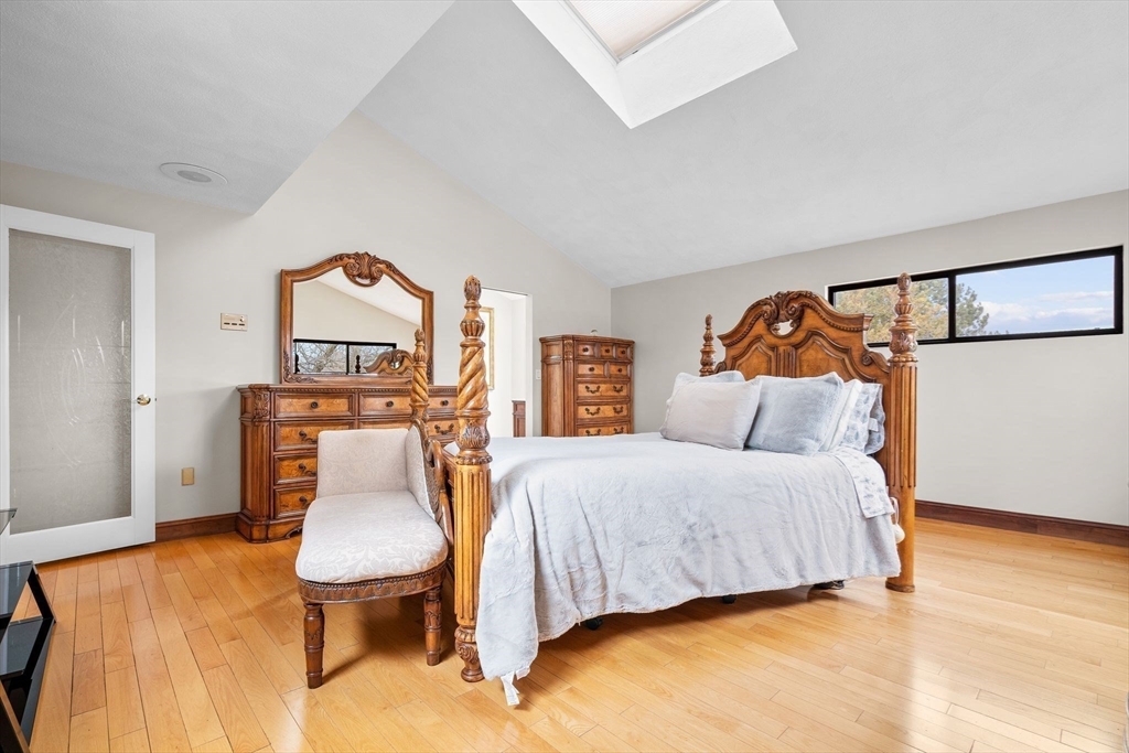 4 Rockland Terrace Saugus, MA 01906 - Photo 20 of 42 a bedroom with a bed a table and chair