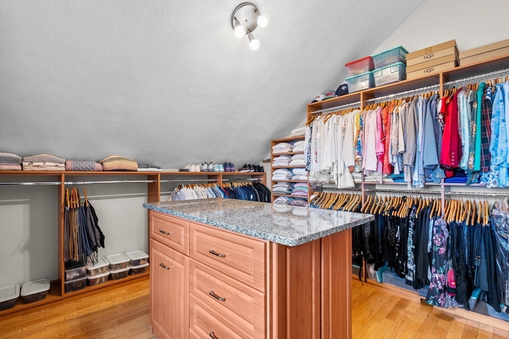 4 Rockland Terrace Saugus, MA 01906 - Photo 21 of 42 a view of walk in closet with clothes and shoes