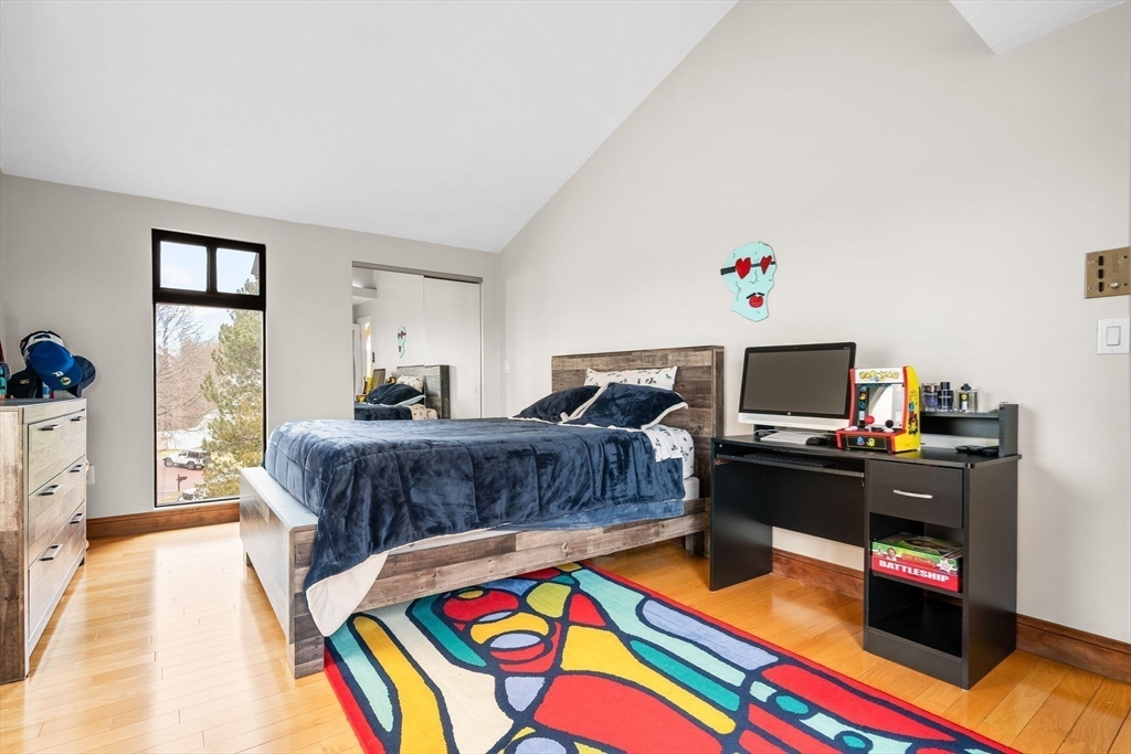 4 Rockland Terrace Saugus, MA 01906 - Photo 24 of 42 a bedroom with a bed and wooden floor