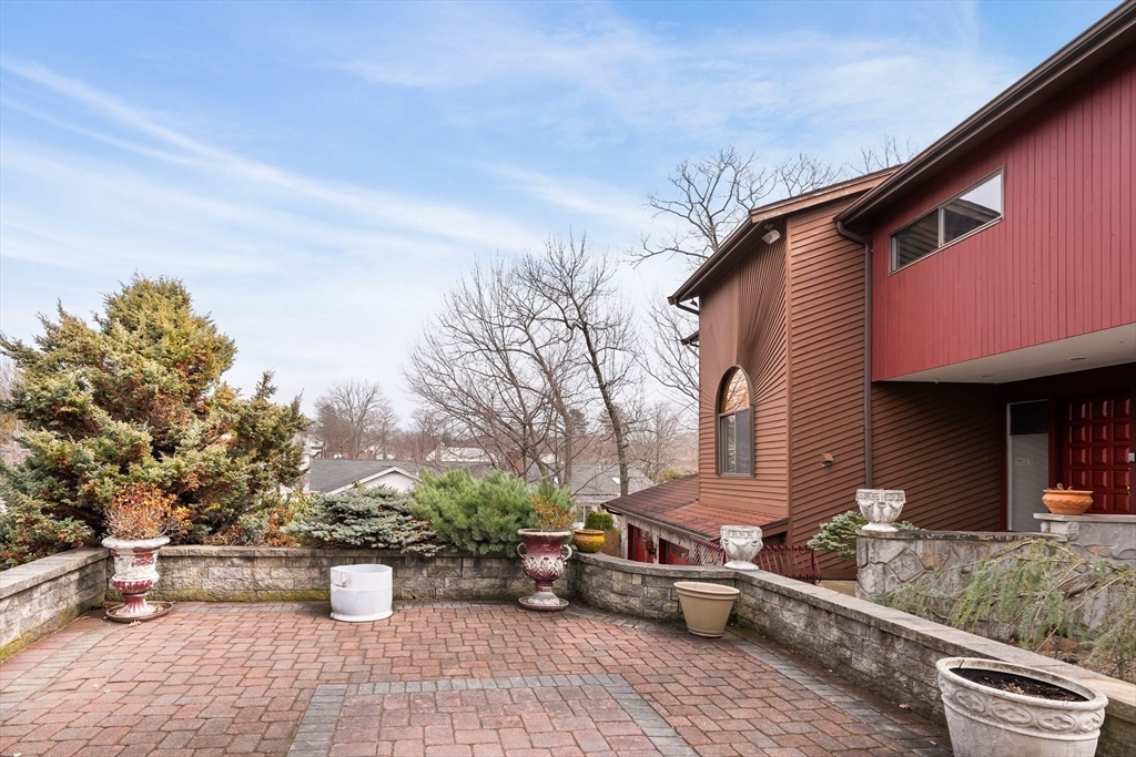 4 Rockland Terrace Saugus, MA 01906 - Photo 38 of 42 a view of a patio with table and chairs and potted plants