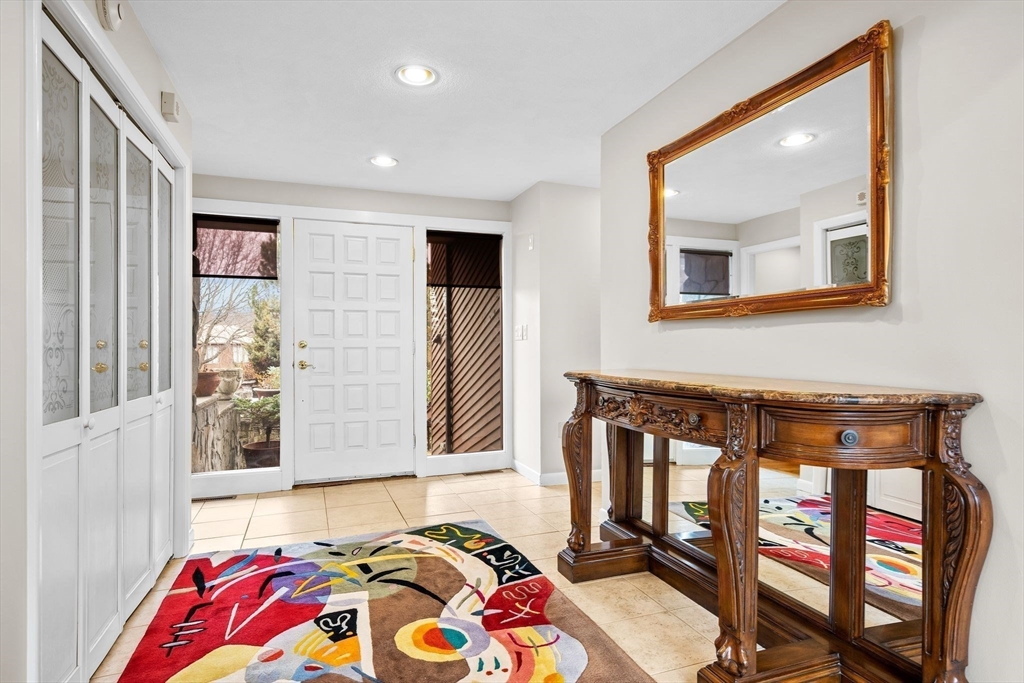 4 Rockland Terrace Saugus, MA 01906 - Photo 4 of 42 a bedroom with a bed and wooden floor